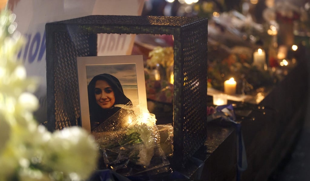A photo of Anne Marie D’Amico, who died in an incel-linked mass killing two years ago, is shown at a vigil in Toronto in April 2018. Photo: AFP