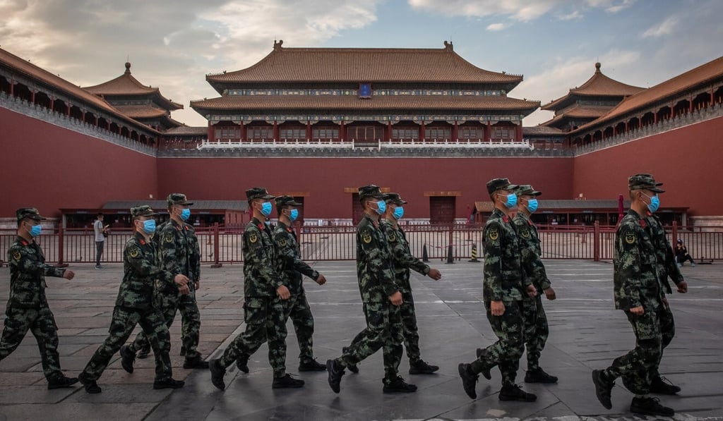 People’s Liberation Army (PLA) soldiers wearing protective face masks march past the entrance to the Forbidden City, in Beijing. China will hold the Chinese People’s Political Consultative Conference (CPPCC) on Thursday and the National People's Congress (NPC) on Friday. Photo: EPA-EFE People’s Liberation Army (PLA) soldiers wearing protective face masks march past the entrance to the Forbidden City, in Beijing. China will hold the Chinese People’s Political Consultative Conference (CPPCC) on Thursday and the National People's Congress (NPC) on Friday. Photo: EPA-EFE