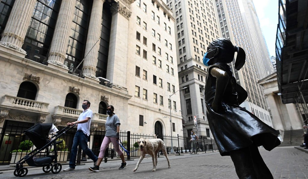 The Fearless Girl statue, now masked, overlooking the New York Stock Exchange. Photo: AFP The Fearless Girl statue, now masked, overlooking the New York Stock Exchange. Photo: AFP