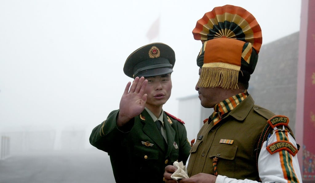 A Chinese soldier and an Indian soldier near the shared border in India’s northeastern Sikkim state. Photo: AFP A Chinese soldier and an Indian soldier near the shared border in India’s northeastern Sikkim state. Photo: AFP