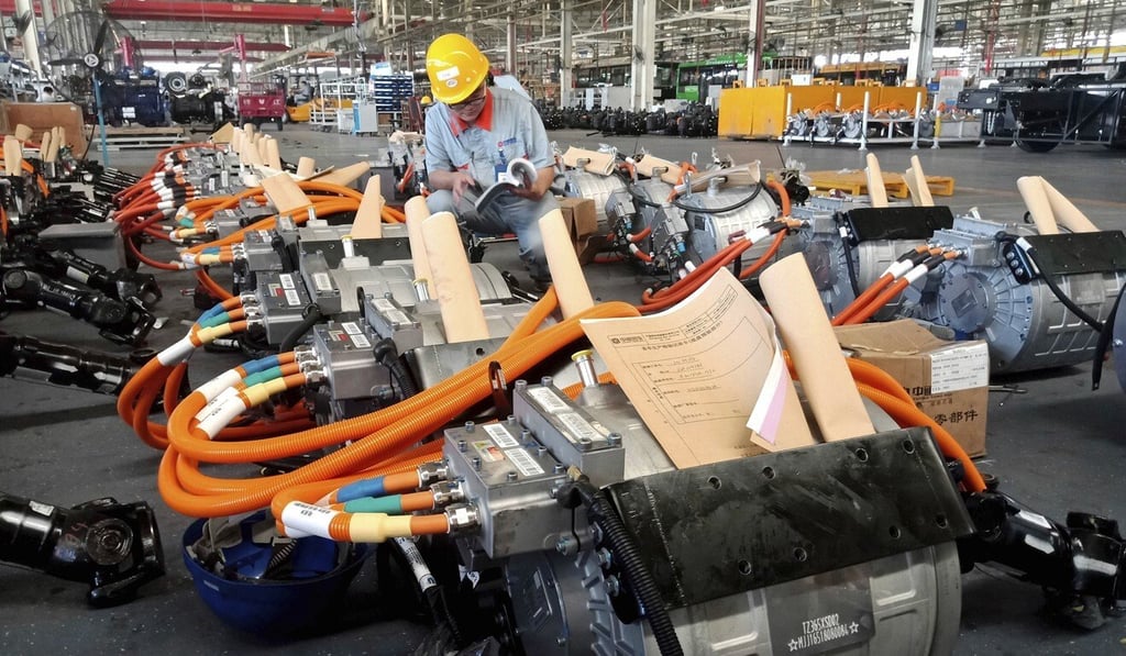A worker checks a manual in an auto parts factory in Liaocheng in eastern China’s Shandong province on August 29, 2018. US President Donald Trump’s tariffs on imports from China have wreaked havoc on global supply chains. Photo: AP