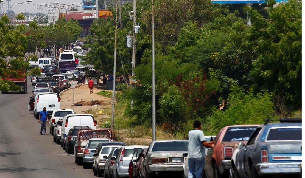 People with vehicles wait in line in an attempt to refuel at a petrol station in Maracaibo, Venezuela. File photo: Reuters People with vehicles wait in line in an attempt to refuel at a petrol station in Maracaibo, Venezuela. File photo: Reuters