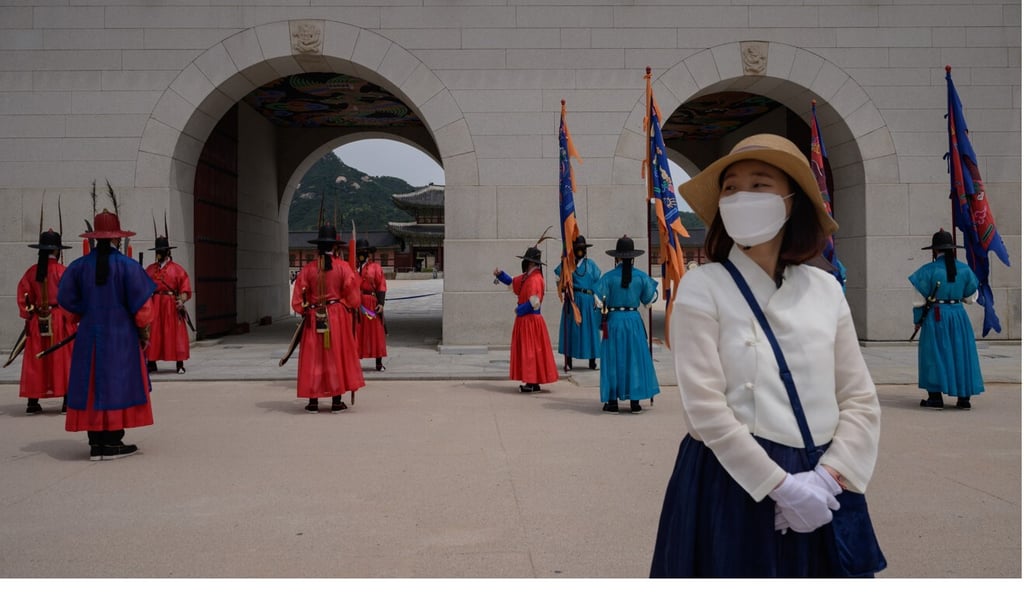 Costumed royal guards take part in a “changing of the guards” ceremony at Gyeongbokgung palace in Seoul. South Korea and China are among the first nations to have opened a travel bubble. Photo: AFP Costumed royal guards take part in a “changing of the guards” ceremony at Gyeongbokgung palace in Seoul. South Korea and China are among the first nations to have opened a travel bubble. Photo: AFP