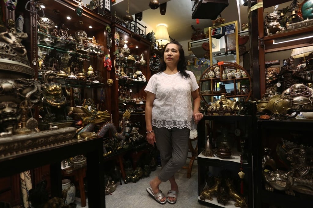 Fong Siu-ying runs T. Wong Art Gallery at Stanley Market. She fears she will have to close unless business picks up. Photo: Jonathan Wong Fong Siu-ying runs T. Wong Art Gallery at Stanley Market. She fears she will have to close unless business picks up. Photo: Jonathan Wong