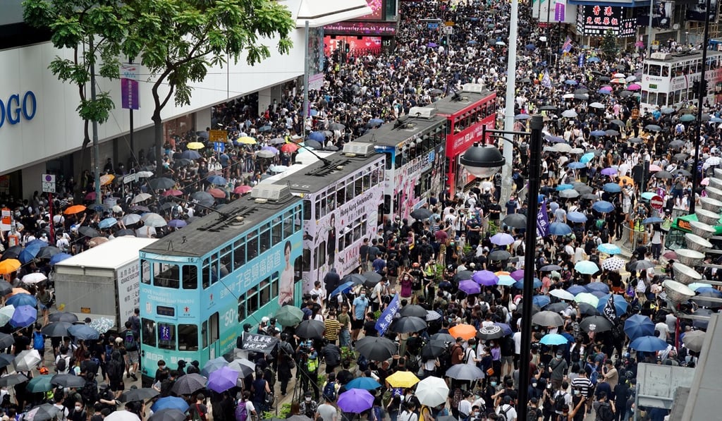 Protests such as the one above on Sunday have hurt Hong Kong’s economy and property prices. Photo: Robert Ng