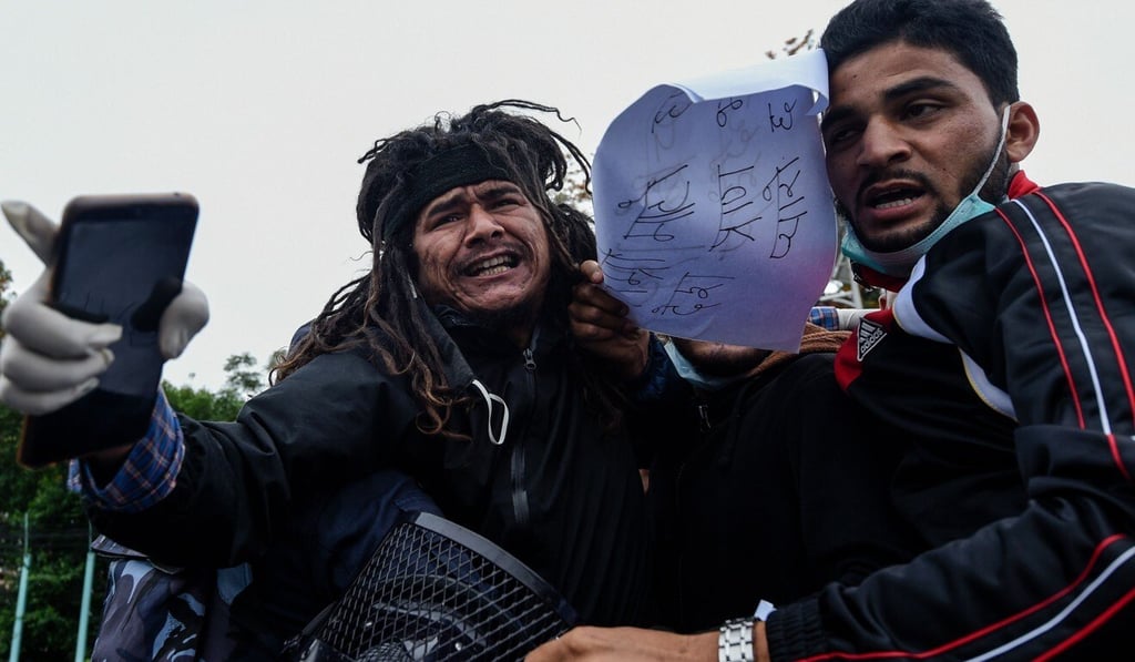 Police detain demonstrators during a protest in Kathmandu against India's newly inaugurated link road to the Chinese border. Photo: AFP