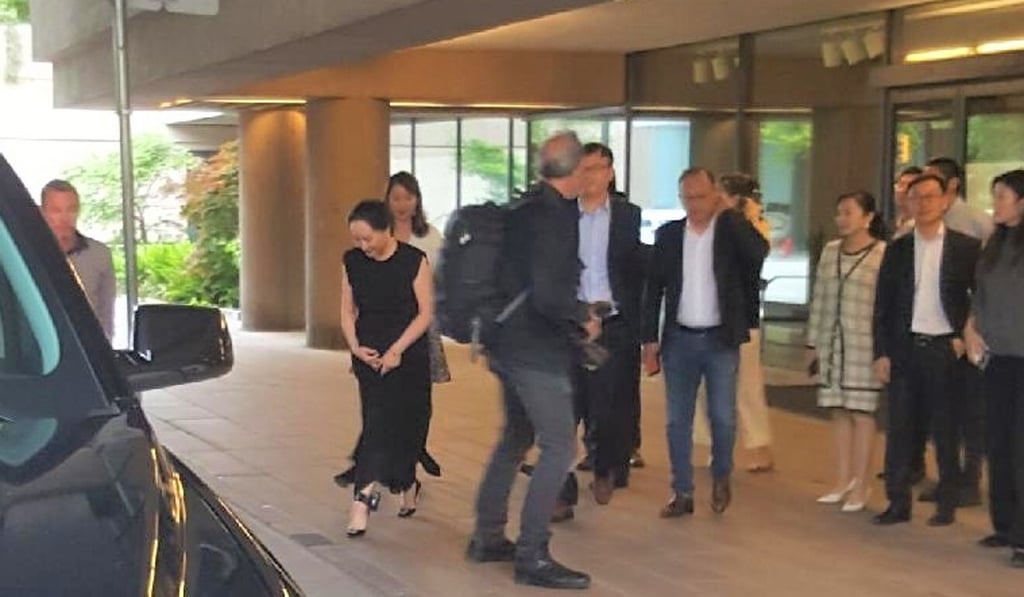 Meng Wanzhou (left) meets supporters outside the BC Supreme Court on Saturday. Her GPS monitoring bracelet can be seen on her ankle. Photo: SCMP