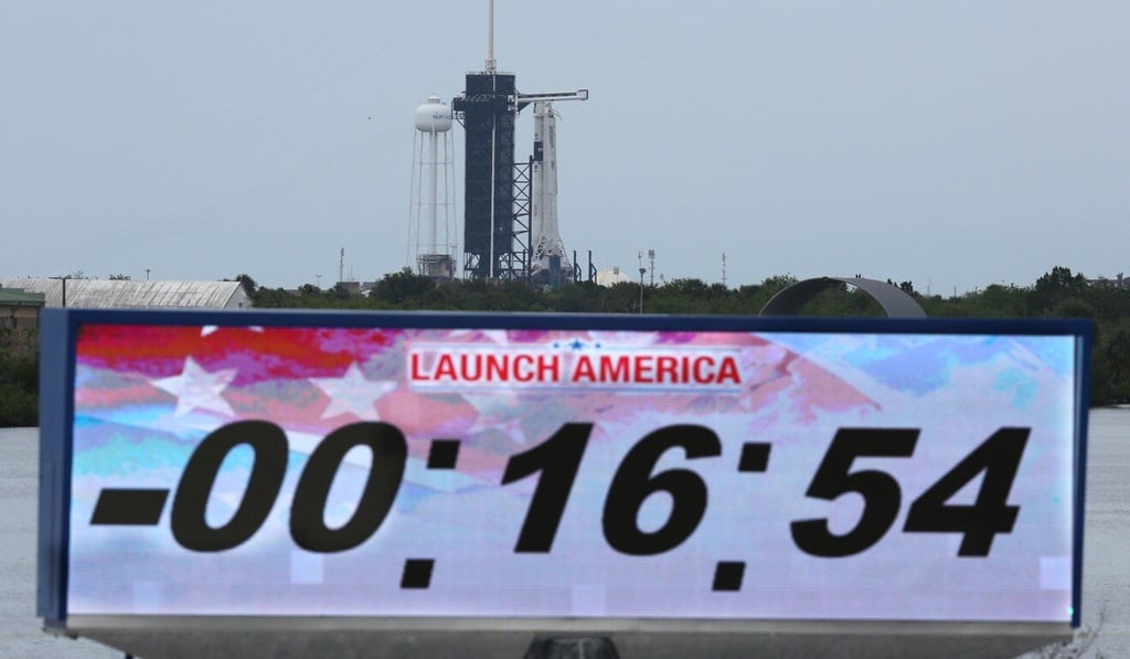 The countdown clock is stopped after the launch of the SpaceX Falcon 9 rocket at Kennedy Space Centre on Wednesday was scrubbed due to bad weather. Photo: AFP