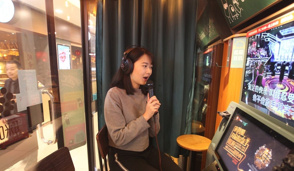 A woman sings in a mini karaoke box in a shopping mall in Beijing on Feb. 08, 2018. Photo: SCMP/Simon Song A woman sings in a mini karaoke box in a shopping mall in Beijing on Feb. 08, 2018. Photo: SCMP/Simon Song