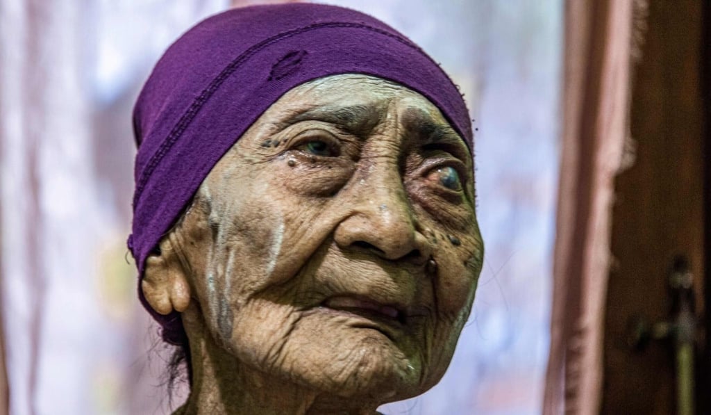 Kamtim, 100, was taken to hospital last month after showing symptoms. Photo: AFP
