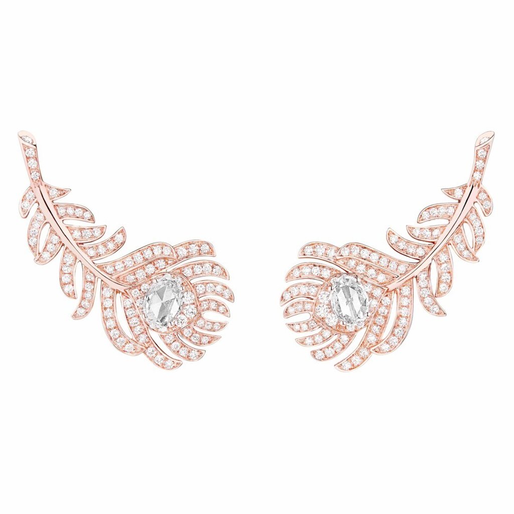 The character pairs these Plume de Paon earclips from Boucheron with a red lace dress and a black blazer. Photo: Boucheron The character pairs these Plume de Paon earclips from Boucheron with a red lace dress and a black blazer. Photo: Boucheron