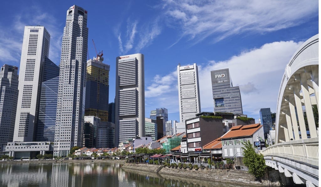 Restaurants and bars in Boat Quay, near Robertson Quay, with Singapore’s central business district in the background. Photo: Bloomberg
