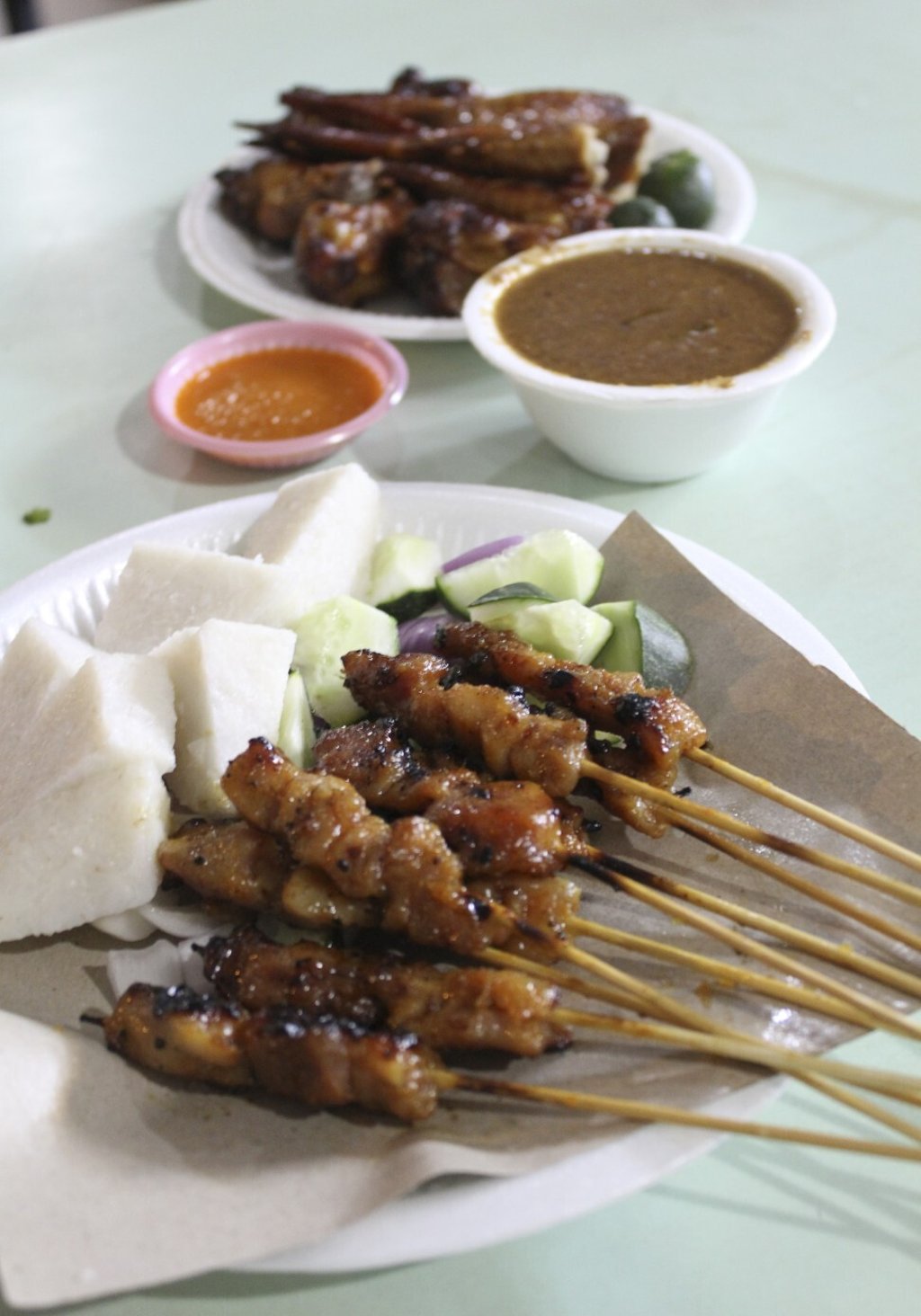 Satay and chicken wings at a hawker centre in Singapore. Photo: Juliana Loh