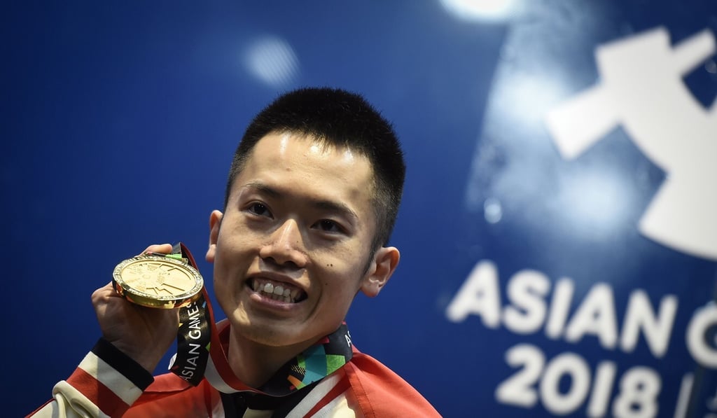 Leo Au celebrates one of his greatest moments in squash after clinching the 2018 Asian Games individual men’s gold medal. The 30-year-old is retiring from the sport this week. Photo: AFP Leo Au celebrates one of his greatest moments in squash after clinching the 2018 Asian Games individual men’s gold medal. The 30-year-old is retiring from the sport this week. Photo: AFP