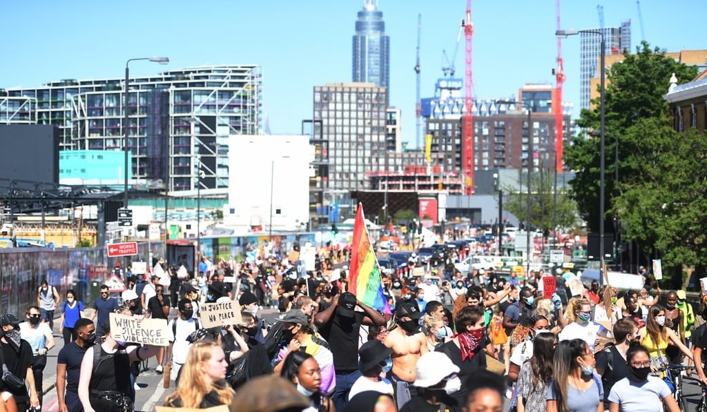 Supporters of the Black Lives Matter movement in London protest against the killing of George Floyd while in police custody in the United States. Photo: EPA