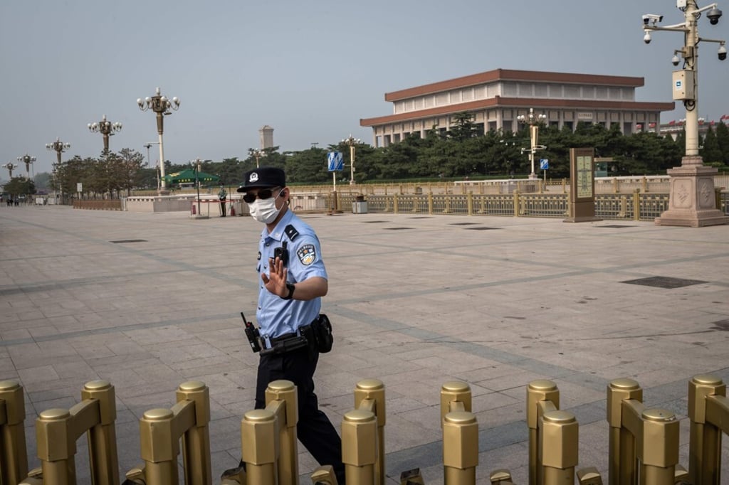 A police officer patrols in Beijing’s Tiananmen Square on May 3. Photo: AFP A police officer patrols in Beijing’s Tiananmen Square on May 3. Photo: AFP