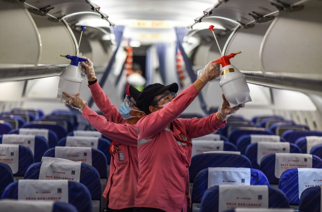 Staff disinfect the cabin of an aeroplane after its arrival at the Haikou Meilan International Airport in Haikou, south China's Hainan province on January 31, 2020. Photo: Xinhua