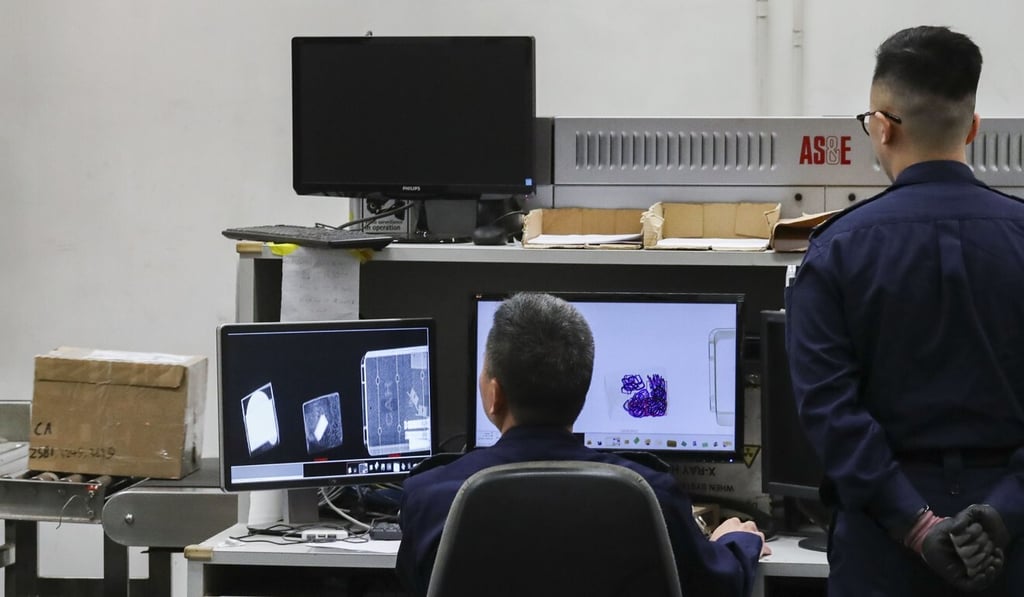 Customs officers demonstrate how X-rays are used to check incoming air parcels at Hong Kong International Airport. Photo: K.Y. Cheng Customs officers demonstrate how X-rays are used to check incoming air parcels at Hong Kong International Airport. Photo: K.Y. Cheng