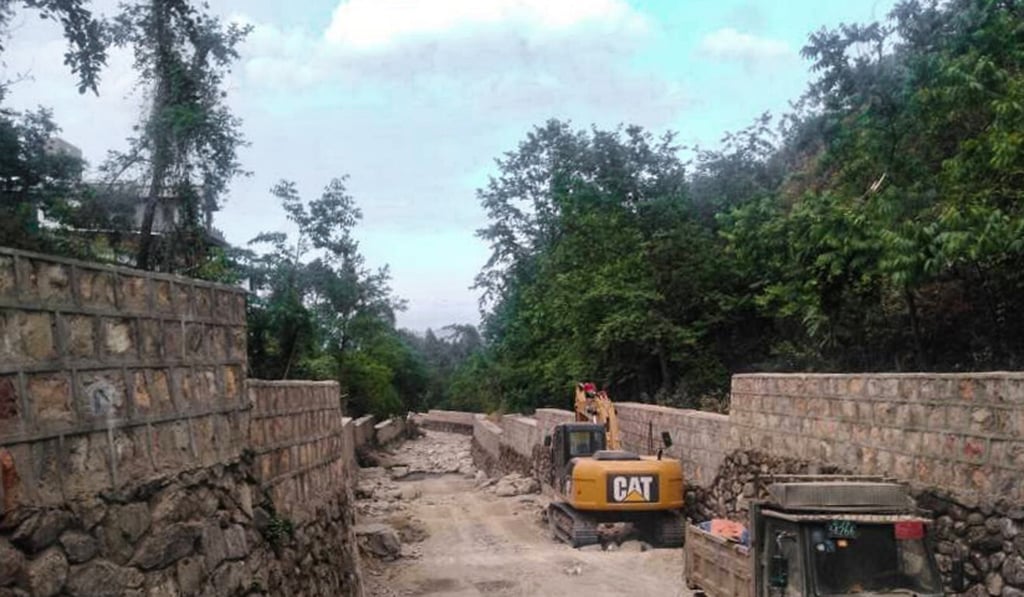 Bulldozers at Baihe Creek in April. Photo: Handout