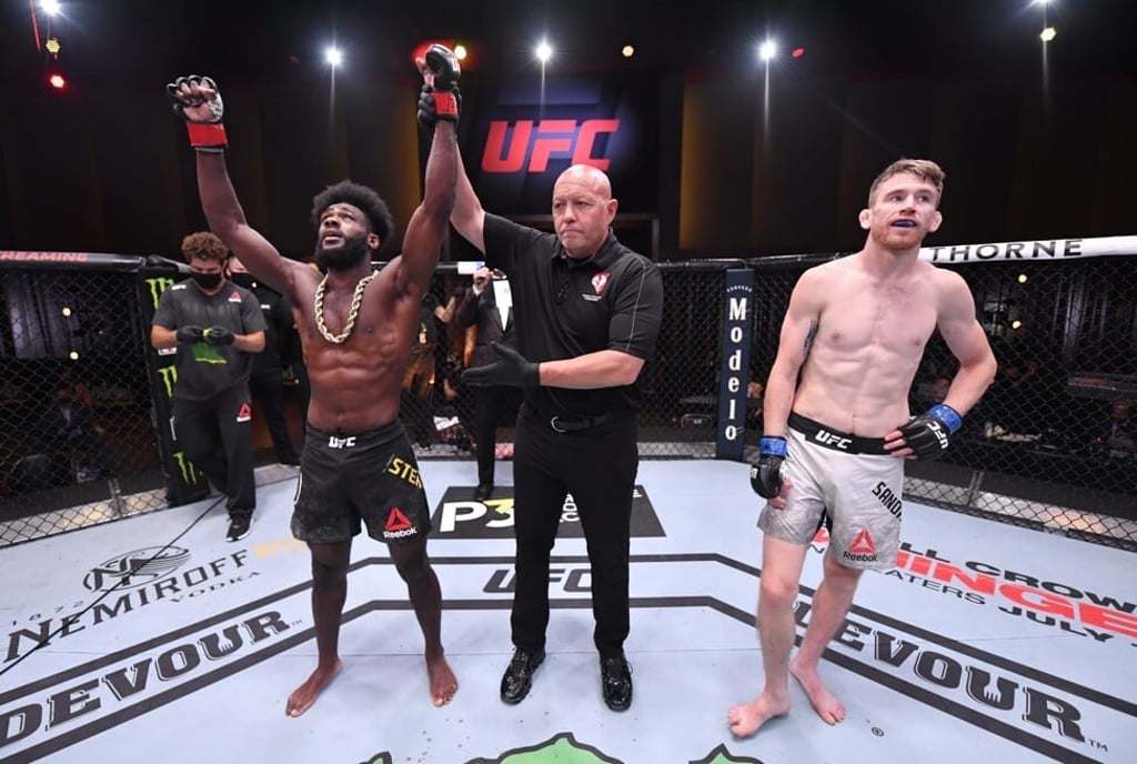Aljamain Sterling celebrates after his submission victory over Cory Sandhagen.