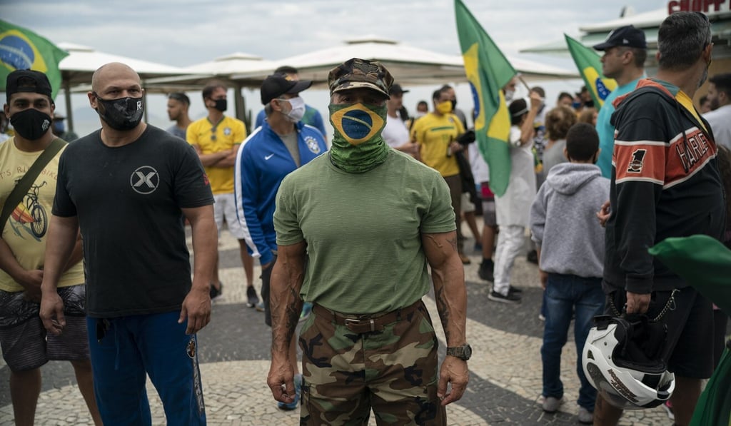 A demonstrator poses for a photos as he takes part in a protest in support of Brazil’s President Jair Bolsonaro. Photo: AP Photo