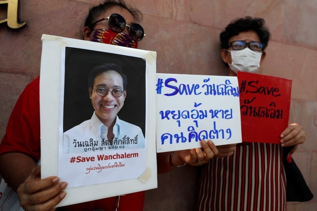 People hold signs in support of abducted Thai activist Wanchalearm Satsaksit in Bangkok on June 8, 2020. Photo: Reuters