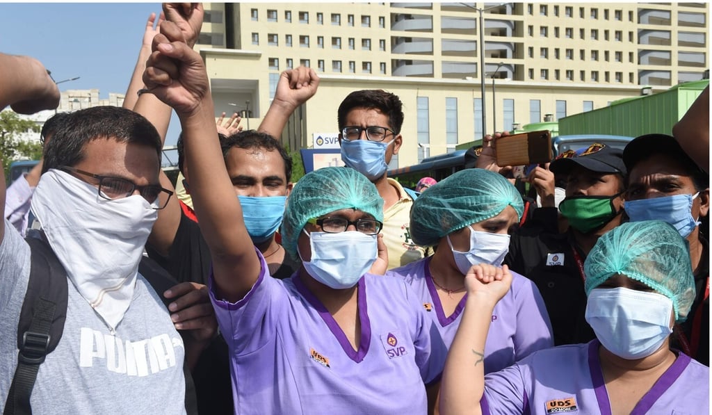 Nursing staff protest against pay cuts at the Sardar Vallabhbhai Patel Institute of Medical Sciences and Research in Ahmedabad, Gujarat, on June 8. Photo: AFP