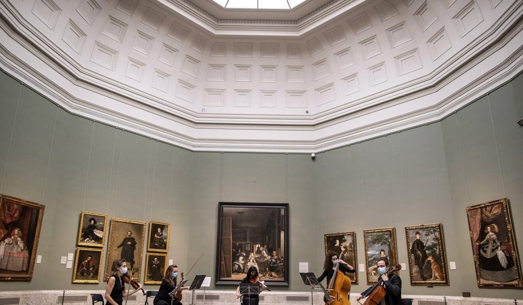 Musicians perform in front of a selection of paintings by Spanish artist Diego Velazquez during the reopening of the Prado museum in Madrid, Spain, to the public last weekend. Photo: AP