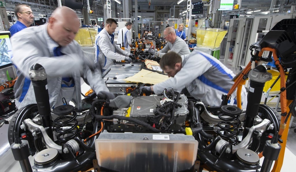Workers complete an electric car body at the assembly line at a Volkswagen plant in Zwickau, Germany, on February 25. The European index is dominated by sectors reliant on strong economic activity. Photo: AP Workers complete an electric car body at the assembly line at a Volkswagen plant in Zwickau, Germany, on February 25. The European index is dominated by sectors reliant on strong economic activity. Photo: AP