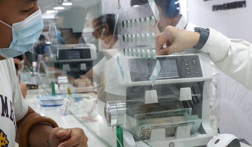 A customer at Rich Bird exchange in Sham Shui Po. Photo: Edmond So