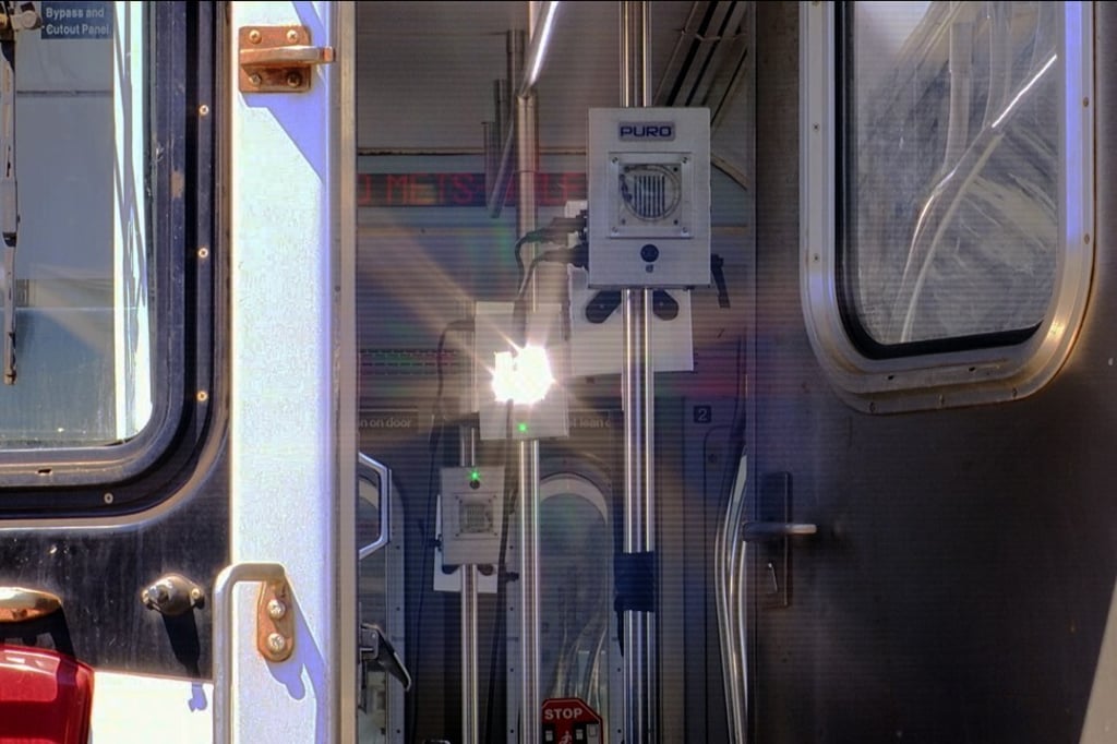 A strobe light bursts along with invisible ultraviolet light intended to kill the new coronavirus on a subway car at a maintenance facility in Corona section of Queens borough of New York. Photo: AP Photo A strobe light bursts along with invisible ultraviolet light intended to kill the new coronavirus on a subway car at a maintenance facility in Corona section of Queens borough of New York. Photo: AP Photo