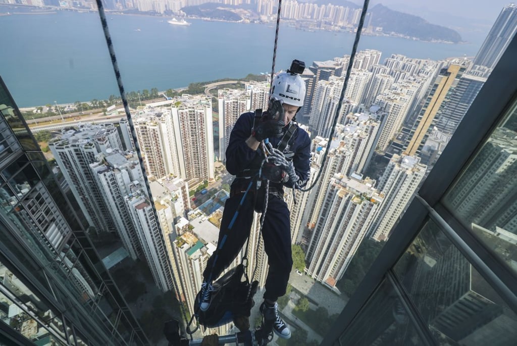 The Securities and Futures Commission’s chief executive Ashley Alder rappelling down from the 68th floor of the One Island East building in Quarry Bay during the Outward Bound Hong Kong (OBHK) Vertical 1000 “The Adventure of A Life Time” event on 9 December 2017. Photo: Winson Wong