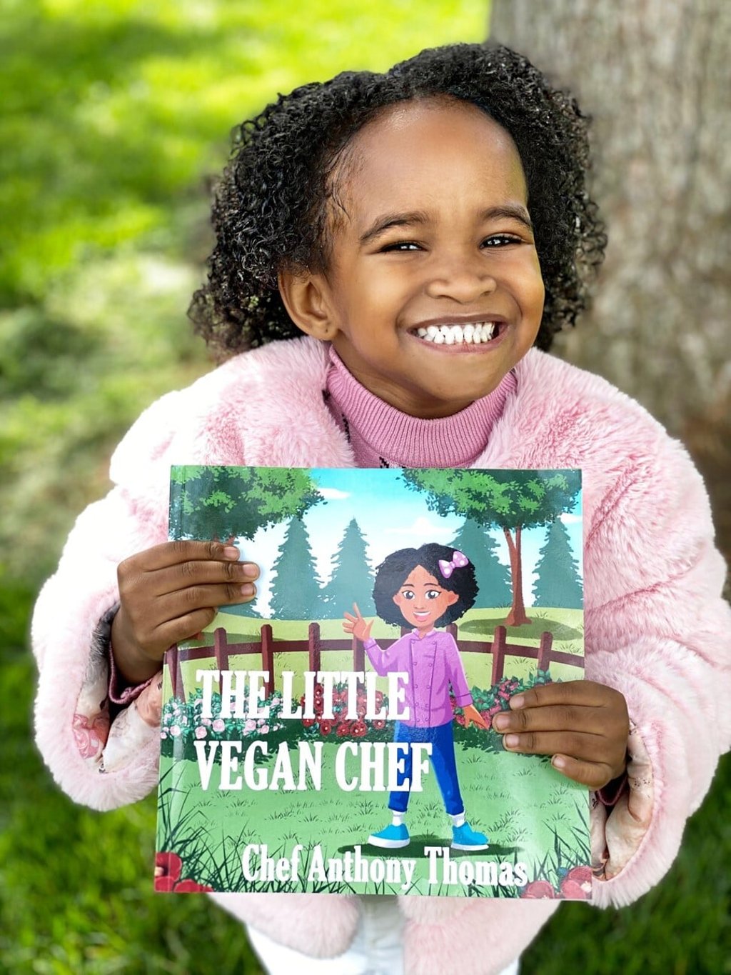 Ashlyn with the new book. Photo: courtesy of Anthony Thomas
