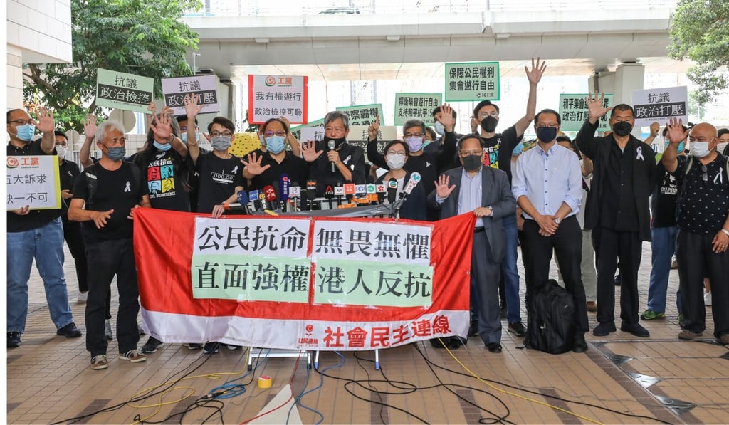Defendants and their supporters remain defiant outside West Kowloon Court. Photo: Dickson Lee