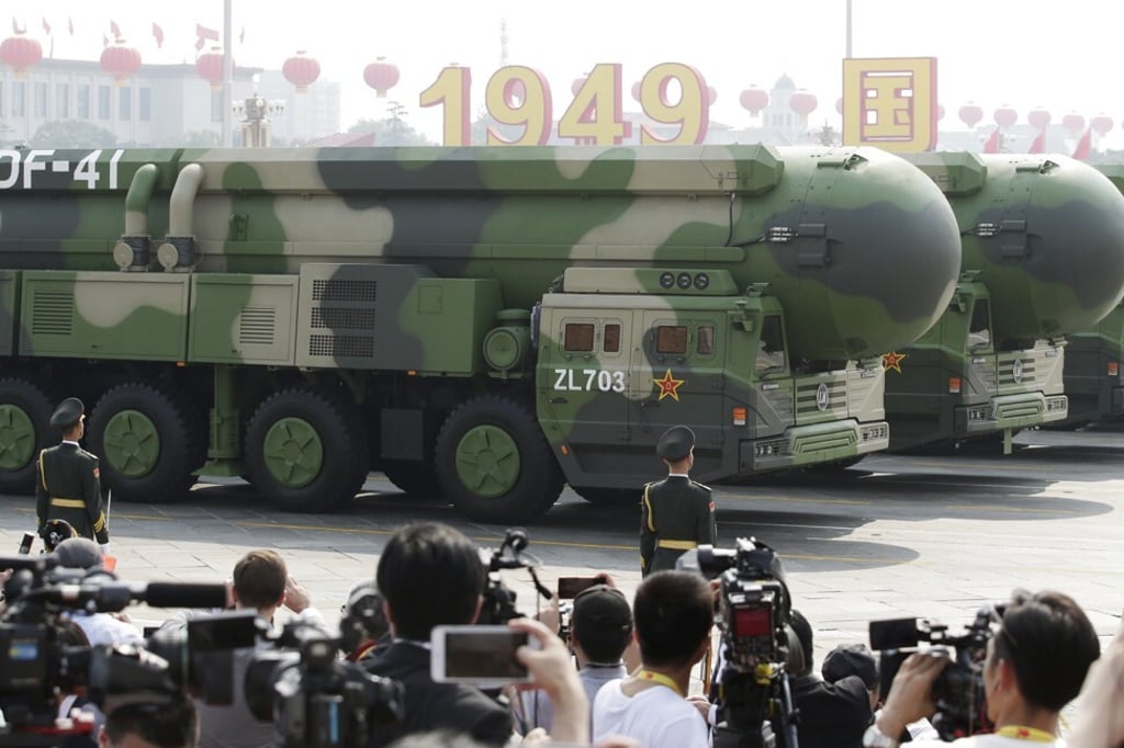 In China, military vehicles carrying DF-41 intercontinental ballistic missiles pass Tiananmen Square in October, 2019. Photo: Reuters