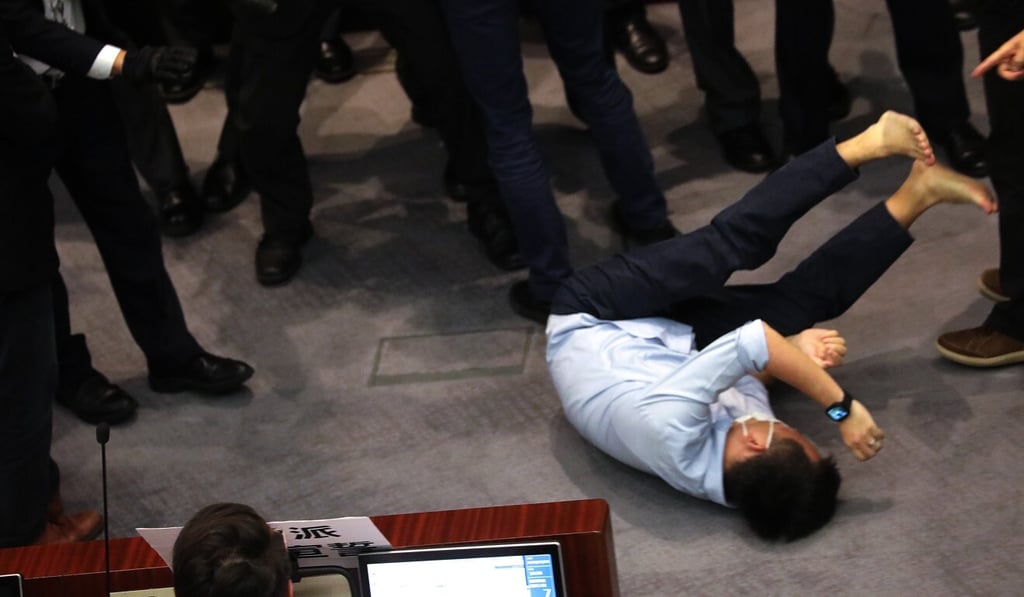 Opposition lawmaker Raymond Chan has filed a private prosecution against pro-Beijing counterpark Kwok Wai-keung, who he has accused of violently dragging him to the floor during a melee in Legco. Photo: Dickson Lee