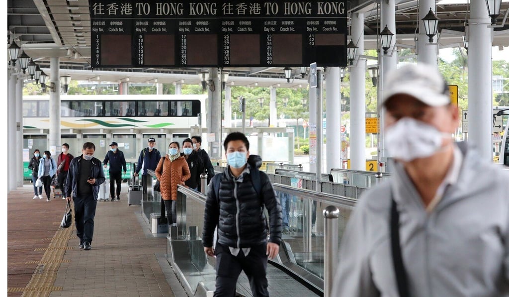 Travellers travel from Hong Kong to mainland China through the Shenzhen Bay Port in February, before Covid-19 mitigation steps largely closed the border. Photo: Felix Wong