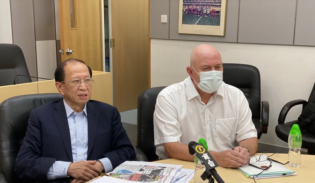 HKFA chairman Pui Kwan-kay and its outgoing chief executive Paul Woodland. Photo: Chan Kin-wa
