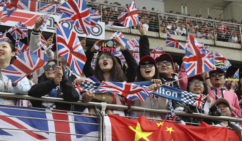 Fans of Mercedes driver Hamilton cheer during the qualifying session for the 2019 Chinese Formula One Grand Prix at the Shanghai International Circuit. Photo: AP Fans of Mercedes driver Hamilton cheer during the qualifying session for the 2019 Chinese Formula One Grand Prix at the Shanghai International Circuit. Photo: AP
