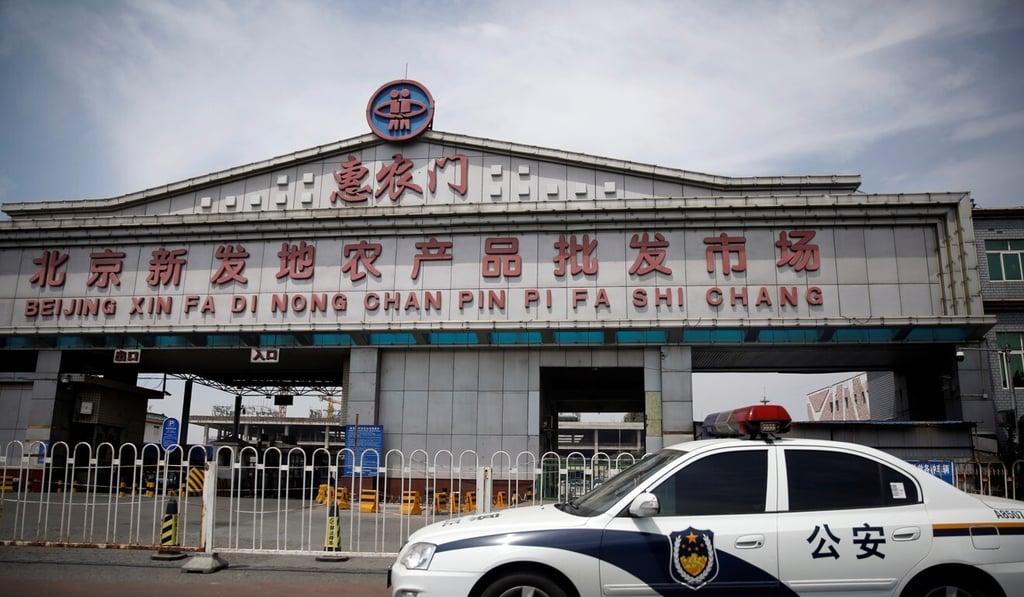 A police vehicle is parked outside the Xinfadi wholesale market, which has been closed following cases of the coronavirus. Photo: Reuters A police vehicle is parked outside the Xinfadi wholesale market, which has been closed following cases of the coronavirus. Photo: Reuters