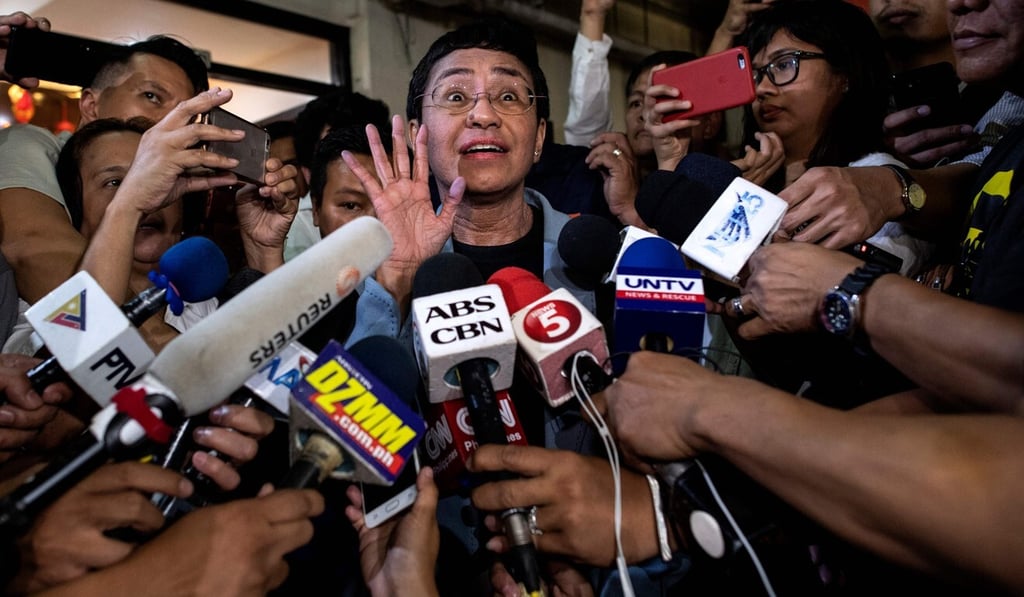Ressa in February 2019, giving a statement after posting bail at a regional trial court in Manila. Photo: AFP
