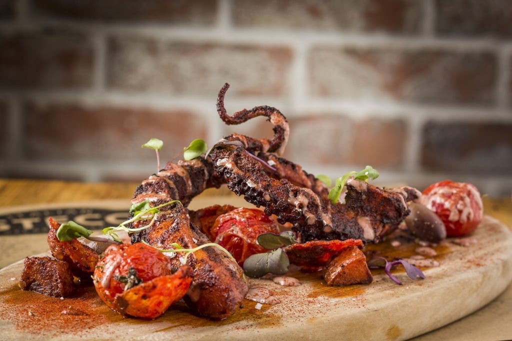 Spiced octopus with crispy potato, aji panca, olive aioli, cherry tomato and chorizo Spiced octopus with crispy potato, aji panca, olive aioli, cherry tomato and chorizo