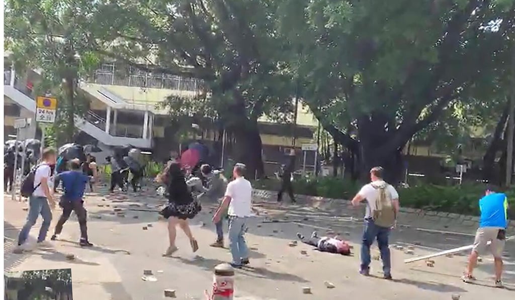 Luo Changqing lies unconscious after being hit by a brick in Sheung Shui. Photo: Handout Luo Changqing lies unconscious after being hit by a brick in Sheung Shui. Photo: Handout