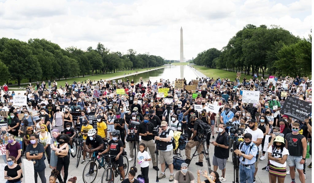 Demonstrators hold placards as they gather at the National Mall in Washington during a demonstration commemorating the Juneteenth holiday. Photo: DPA