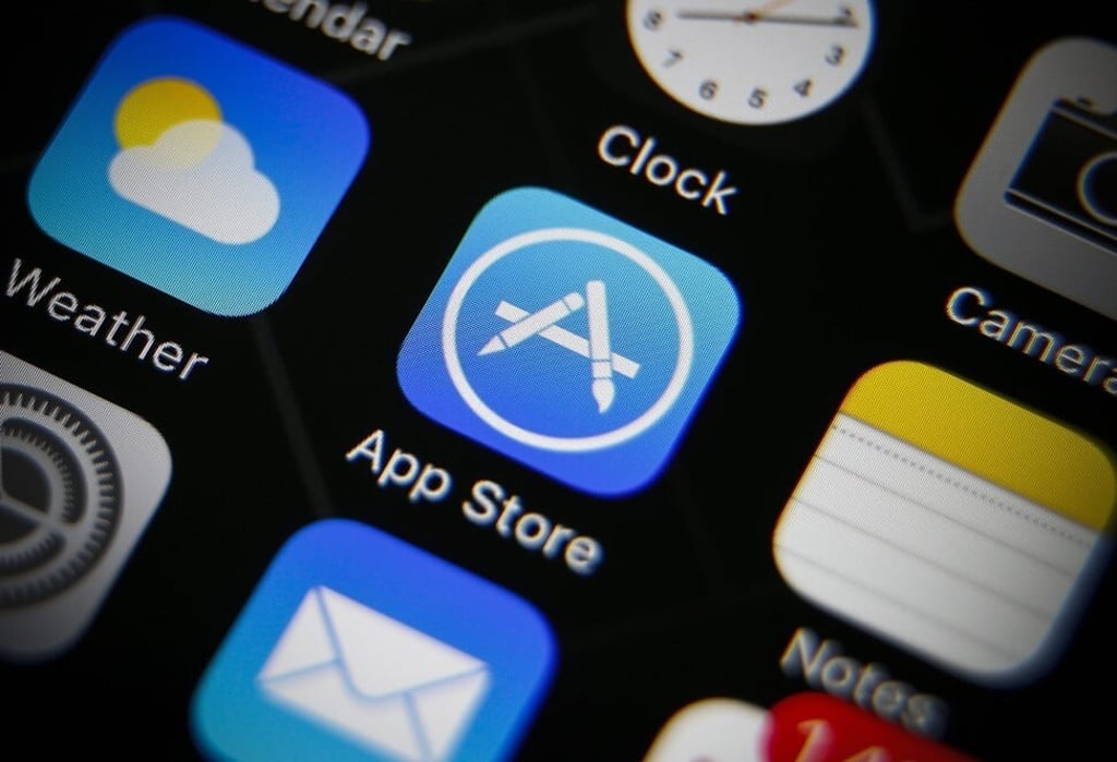 The icon of Apple's App Store, centre, is seen on an iPhone. Photo: EPA The icon of Apple's App Store, centre, is seen on an iPhone. Photo: EPA