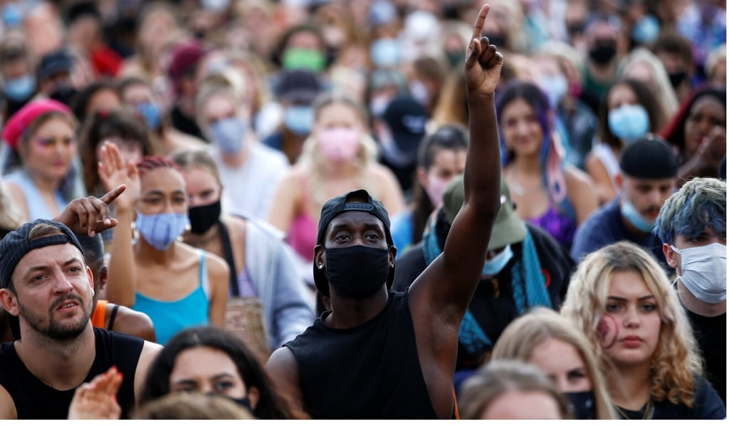 A demonstrator wearing a protective face mask gestures as he attends a Black Lives Matter protest in central London on Saturday. Photo: Reuters