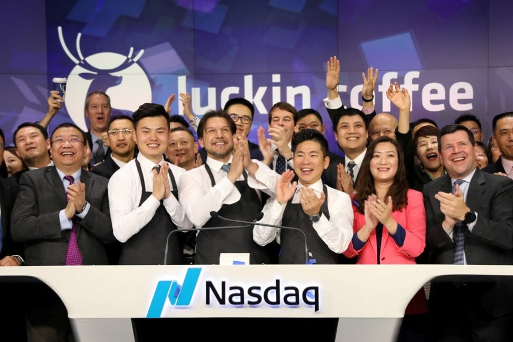 Key executives including Jenny Qian Zhiya and Charles Zhengyao Lu celebrate the coffee chain’s Nasdaq listing day in May 2019. Photo: Reuters