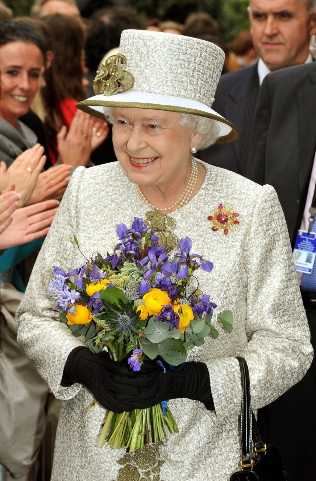Queen Elizabeth wearing the Andrew Grima ruby brooch in 2011. Photo: AFP
