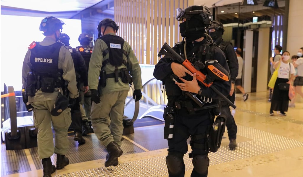 Police officers stand guard in Yoho Mall. Photo: Dickson Lee