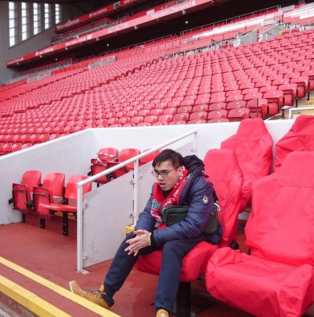 Alton Hwang sits in the home team dugout at Anfield during a visit in 2018. Photo: Handout Alton Hwang sits in the home team dugout at Anfield during a visit in 2018. Photo: Handout